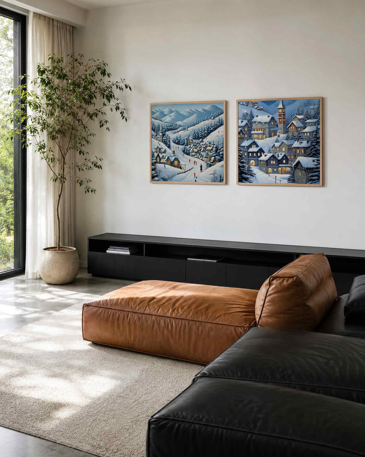 Interieurpresentatie van een tweedelige vierkante posterset met besneeuwd bergdorp