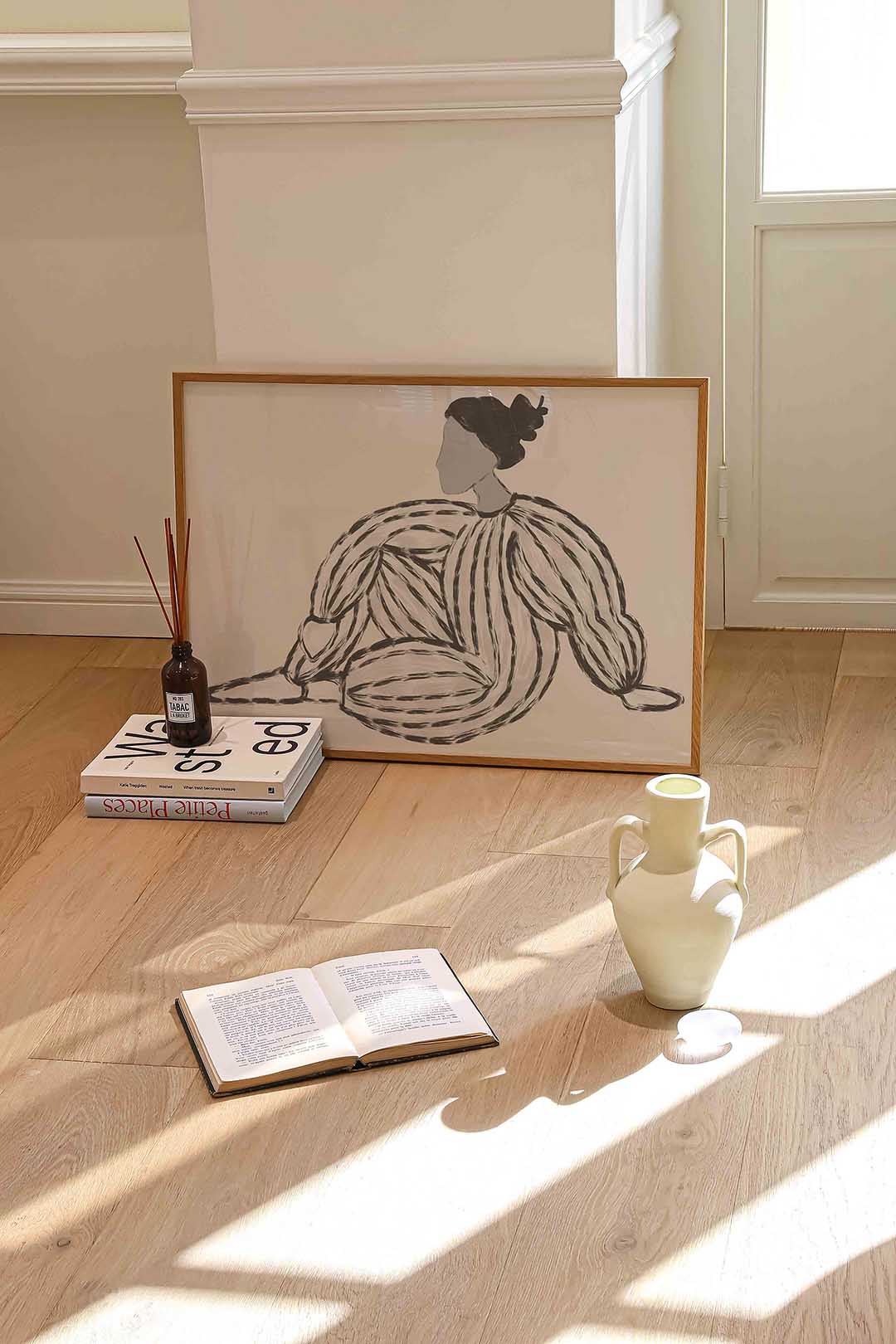 Zittende figuur met gestreepte kleding Poster